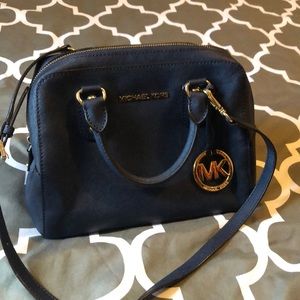 Navy blue Michael Kors handbag with strap